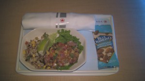 Cold chicken dish served aboard Air Canada flight.